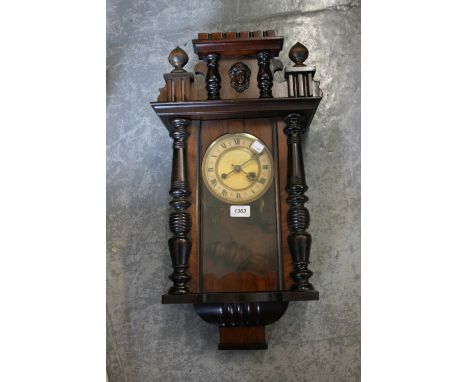20th Century walnut cased Vienna style wall clock having circular dial with Roman numerals and two train movement striking on
