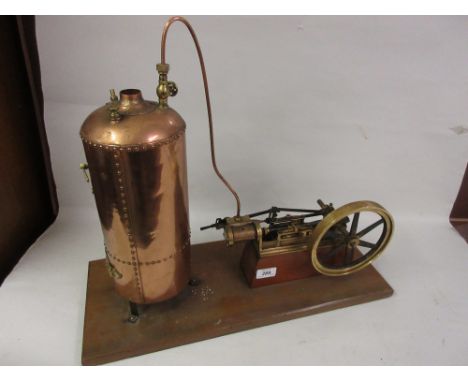 Brass model stationary engine with copper boiler mounted on a mahogany plinth base
