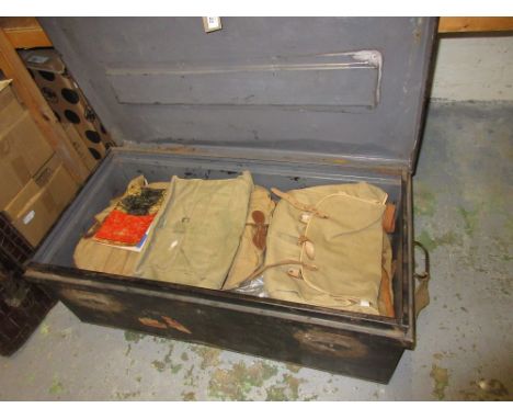 Tin travelling trunk containing a quantity of military webbing, luggage etc