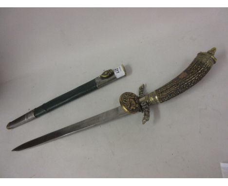 German Hunting Association dagger with a horn grip, brass and silver plated mounts and engraved blade, the green leather scab