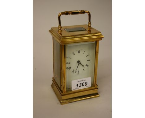 Modern brass cased carriage clock with enamel dial and Roman numerals, signed St. James, in original box