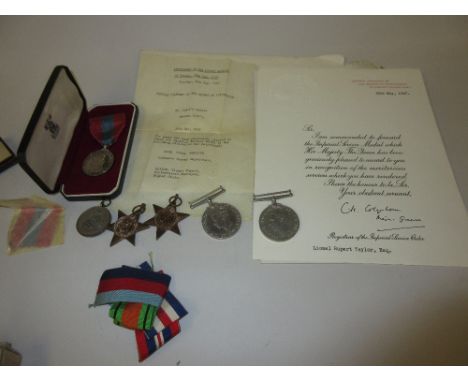 Group of four World War II service medals, together with an Elizabeth II Imperial service medal awarded to Lionel Rupert Tayl