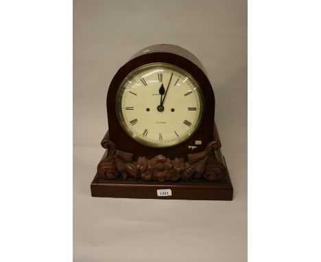 19th Century mahogany bracket clock, the arched case with applied floral decoration, the circular painted dial with Roman num