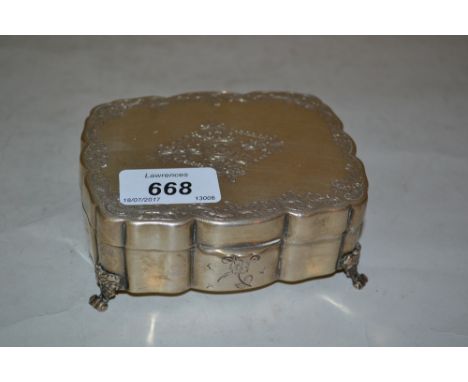 Italian 800 standard silver rectangular trinket box, the hinged cover with floral engraved decoration on low supports, 6 troy