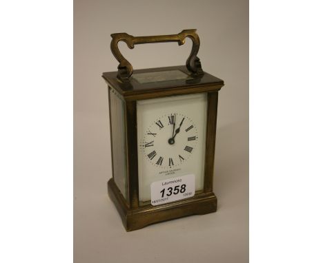 Gilt brass carriage clock, the enamel dial with Roman numerals, inscribed Arthur Saunders, London