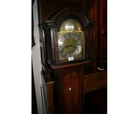Oak cased grandmother clock, circa 1930 with a three train movement striking on gongs