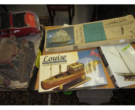 Three model boats (a/f), a wooden model fire engine and a composition toy castle