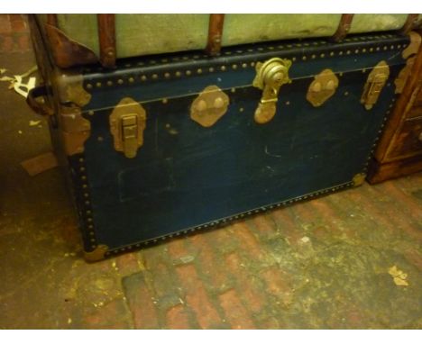 Large blue travel trunk with leather carrying handles