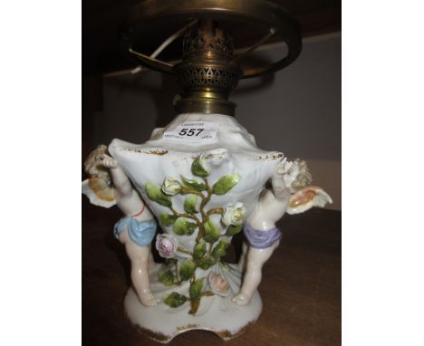 Pair of blanc de chine figural and floral encrusted three branch candelabra (one a/f), and a German porcelain lamp base in th