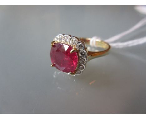 18ct Yellow gold treated ruby and diamond cluster ring