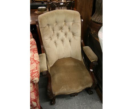 Victorian carved walnut button upholstered open arm drawing room chair on cabriole front supports