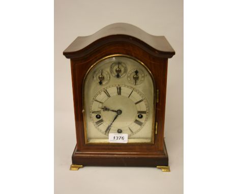 Edwardian mahogany and line inlaid bracket clock, the silvered dial with Roman numerals, three subsidiary dials, the three tr