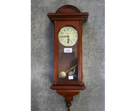Reproduction mahogany single train wall clock together with a reproduction mahogany two train mantel clock