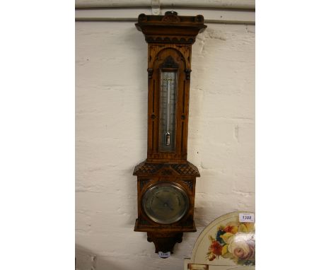 Negretti and Zambra aneroid barometer / thermometer in ornate carved oak case with silvered dials