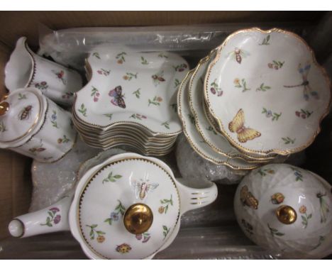 Modern Chinese tea and coffee service in antique style decorated with flowers and insects