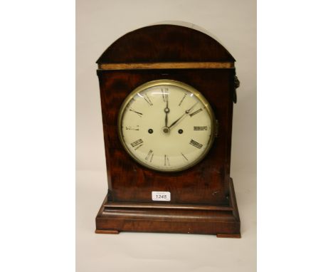Late Regency mahogany bracket clock, the arched architectural case with lion ring side handles, the circular painted dial wit