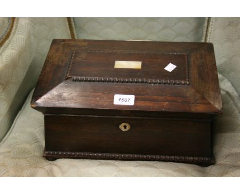 19th Century rosewood mother of pearl inlaid sarcophagus shaped tea caddy with gilt brass lion mask side handles