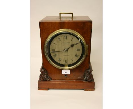 Victorian mahogany bracket clock, the rectangular case with a recessed brass handle and applied carved floral decoration, the