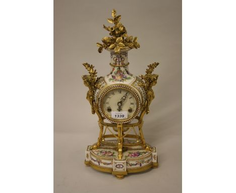 Reproduction French style gilt metal mounted floral painted porcelain two train mantel clock