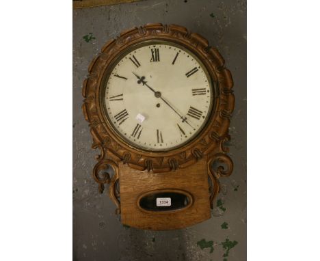 19th Century carved oak drop-dial wall clock having single fusee movement with painted 12in dial and Roman numerals with pend