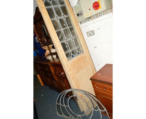 A PAIR OF STAINED PINE SWINGING DOORS, with coloured lead glazed panels and parliament hinges, width 53cm x height 203cm, tog
