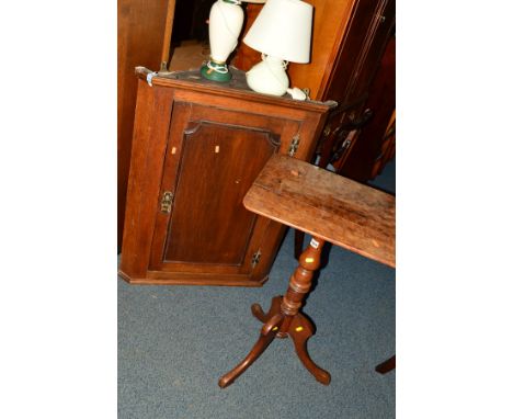 AN EARLY 20TH CENTURY PANELLED OAK HANGING CORNER CUPBOARD and a mahogany tripod table (2)