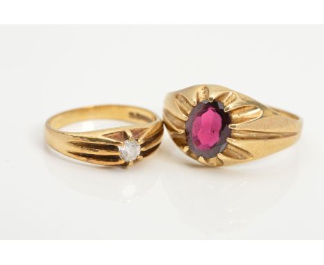 TWO 9CT GOLD GEM SET RINGS, the first a gentleman's signet ring claw set with an oval garnet, ring size U, the second set wit