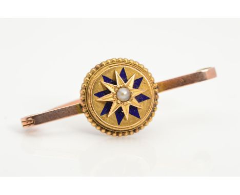 A LATE VICTORIAN 9CT GOLD ENAMEL AND SEED PEARL BROOCH, the circular panel set with a central seed pearl in a star mount with