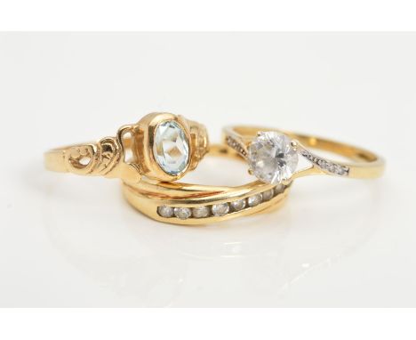THREE 9CT GOLD RINGS, the first designed as a single circular cubic zirconia, the second a diagonal line of nine channel set 