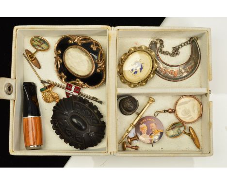 A SELECTION OF VARIOUS ITEMS, to include a mid Victorian black enamel memorial brooch with central woven hair panel, a small 