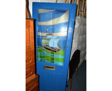 A PAINTED FRONT DOOR with a lead glazed window light of a ship at sea, width 81cm x height 201cm