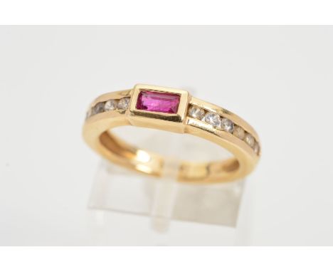 A RUBY AND DIAMOND RING, designed as a rectangular collet set ruby to the channel set brilliant cut diamond shoulders, estima