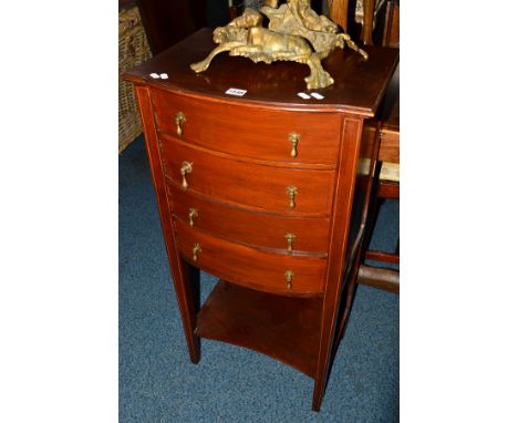 AN EDWARDIAN MAHOGANY AND INLAID FOUR DOOR MUSIC CABINET on square tapering legs united by an under shelf, width 48cm x depth