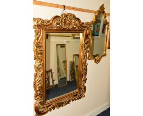 A MODERN FOLIATE GILT RESIN BEVELLED EDGE WALL MIRROR, 91cm x 130cm, together with another gilt framed wall mirror, oak wall 