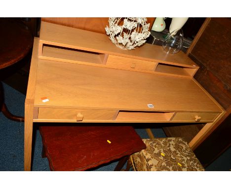 A MODERN LIGHT OAK DESK with three various drawers, width 114cm x depth 61cm x height 86cm