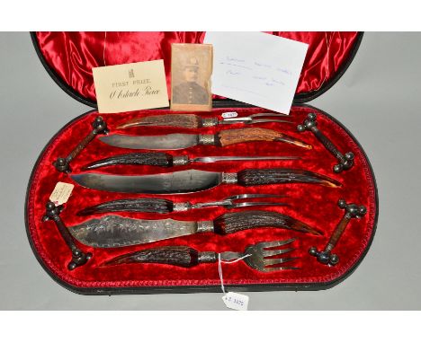 A LATE VICTORIAN CASED HORN HANDLED MEAT AND GAME CARVING AND FISH SERVING SET WITH KNIFE RESTS, the lid bears presentation p