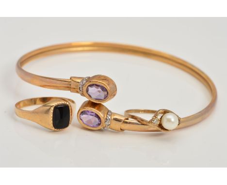 A 9CT GOLD AMETHYST AND DIAMOND TORQUE BANGLE AND TWO 9CT GOLD RINGS, the bangle of cross over spring design set to each term