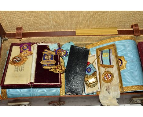 A CASE OF MASONIC REGALIA, including several silver gilt medallions, apron, cuffs, sash, white gloves, etc