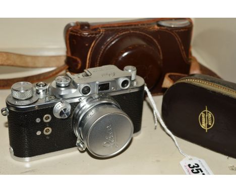 A REID &amp; SIGRIST REID 3 RANGEFINDER CAMERA, fitted with a Leitz Summacron 5cm f2 lens, a Reid fitted leather case and a W