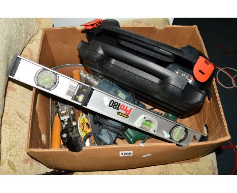 A BOX CONTAINING A CASED BLACK AND DECKER DRILL, Black and Decker heat gun, Bosch drill, two Stanley spirit levels, Stanley R