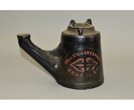 A CAST IRON WELLS UNBREAKABLE OIL LAMP, black body with lettering and design picked out in red (some wear), complete with lid