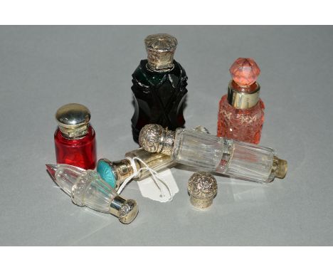 SIX LATE 19TH TO EARLY 20TH CENTURY GLASS LIDDED SCENT AND SALT BOTTLES, to include a double ended scent bottle, a faceted da