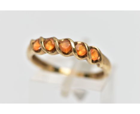 A 9CT GOLD FIRE OPAL FIVE STONE RING, the circular cut fire opals within a partial twist collet setting, to the plain band, h