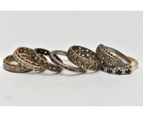 A SELECTION OF PREDOMINANTLY METAL GEM SET RINGS, to include a silver gilt sapphire and cubic zirconia seven stone ring, hall