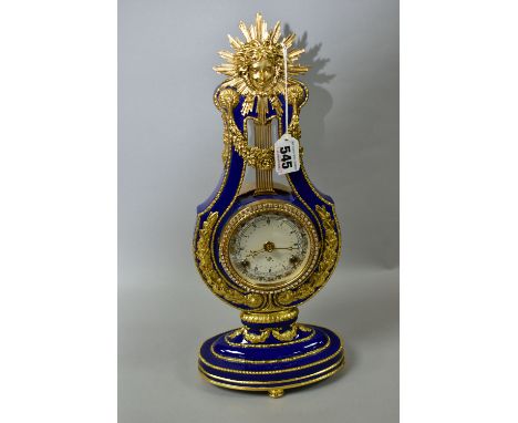 A MARIE-ANTIONETTE PORCELAIN CLOCK, a Victoria and Albert museum reproduction mantle clock, cobalt blue porcelain with gilt e