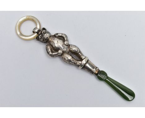 AN EARLY 20TH CENTURY SILVER BABY RATTLE, in the form of a standing bear, markers mark rubbed, hallmarked Birmingham 1915, fi