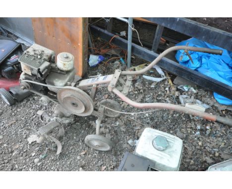 A VINTAGE WOLSELEY TITAN PETROL TILLER (condition:-rusty condition, engine seized)