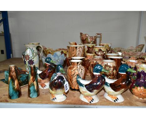 A LARGE QUANTITY OF J FRYER AND SON OLDCOURT WARE, approximately forty pieces, including jugs, vases, bowls, a wall pocket, a