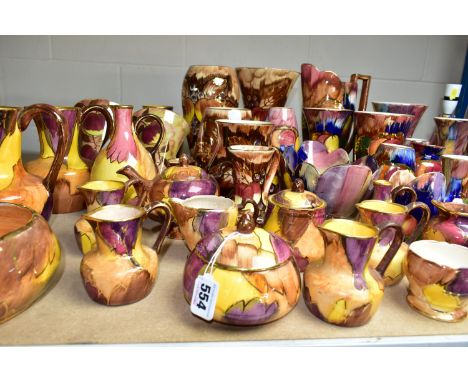 A LARGE QUANTITY OF J FRYER AND SON OLDCOURT WARE, approximately sixty pieces, including jugs, vases, bowls, wall pockets, a 