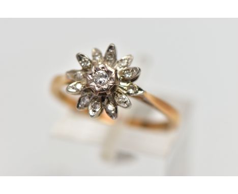 AN 18CT GOLD DIAMOND FLORAL CLUSTER RING, the central brilliant cut diamond, claw set, to the single cut diamond petal surrou